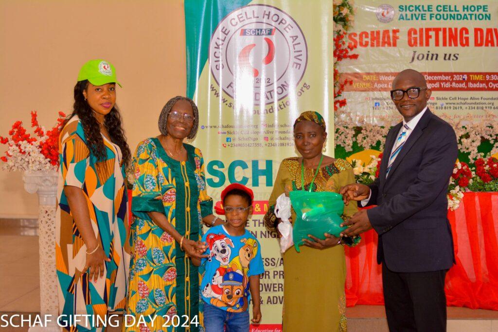 Warriors and caregivers receiving food and medication packages. Alt: Distribution of food and medical supplies at SCHAF December Gifting Day
